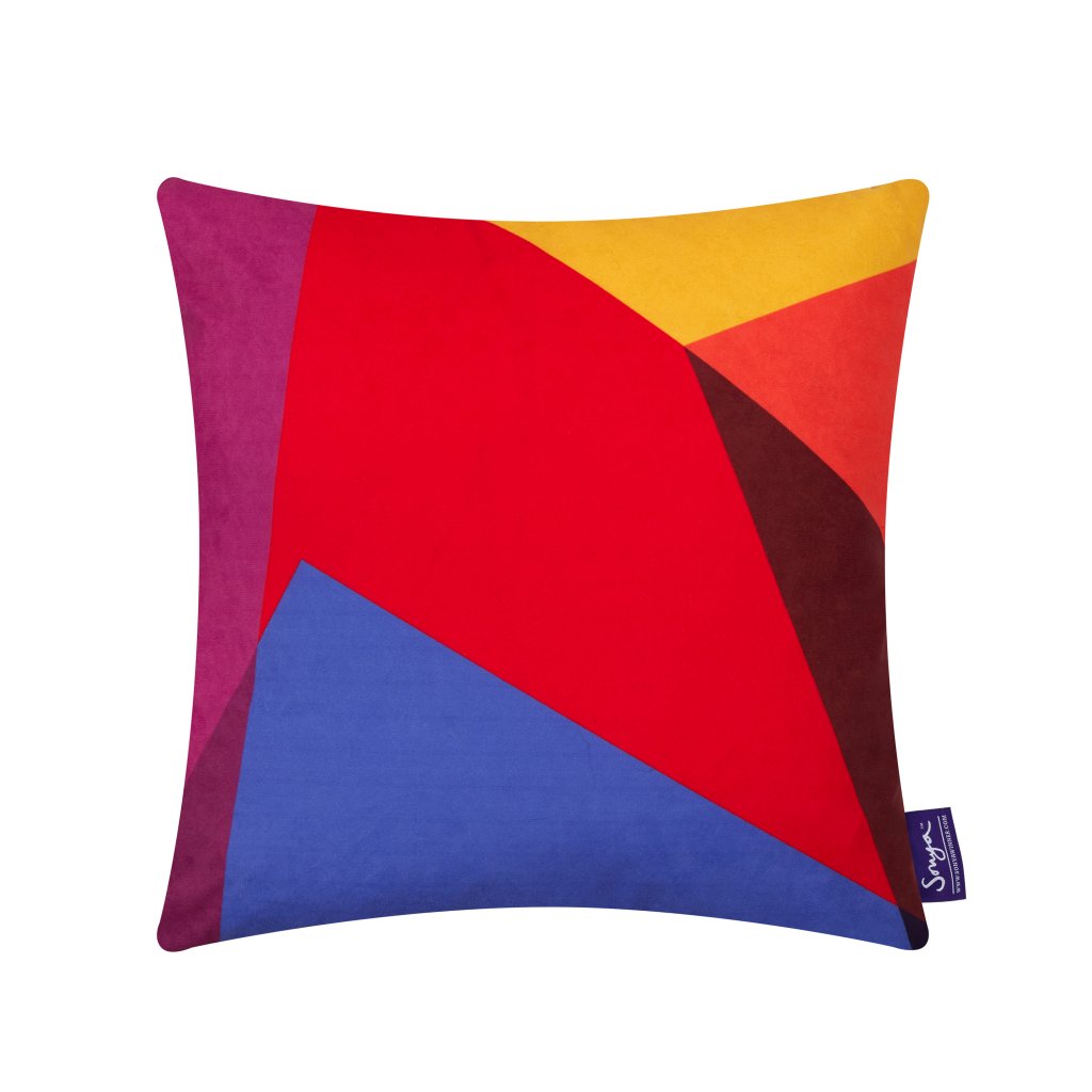 A cropped detail image of the colourful Sonya Winner After Matisse Harlequin cushion, showcasing the bright blue, red, yellow and pink colours, playful pattern and rich texture