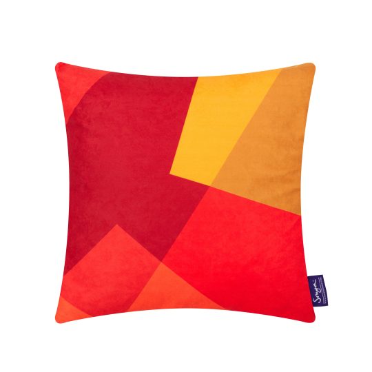 A cropped detail image of the modern Sonya Winner After Matisse Fire cushion, showcasing the bright red and yellow colours, geometric pattern and rich faux suede texture