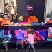 Sonya Winner Studio's commercial stall at York Rise Street Festival, displaying a selection of Sonya's modern colourful rugs and cushions
