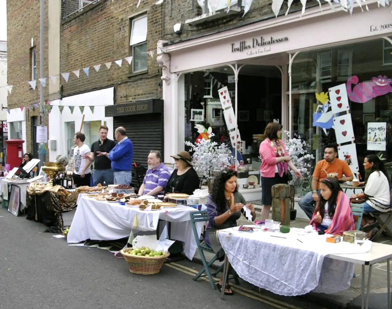 Truffles Delicatessen's food stalls on the street, displaying Truffles' signature cakes and sandwiches during the annual York Rise Street Festival
