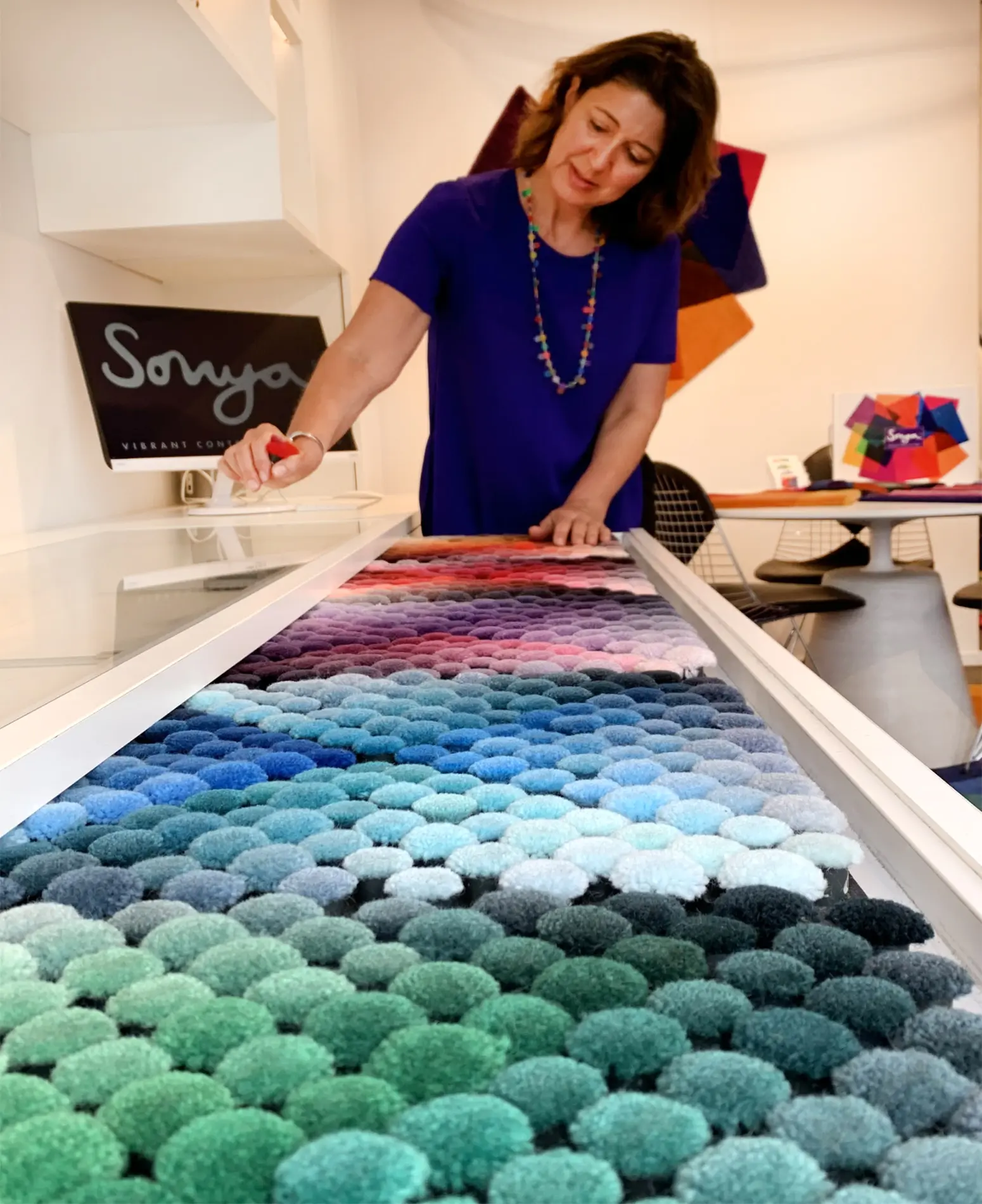 Sonya choosing rug colours in her London studio