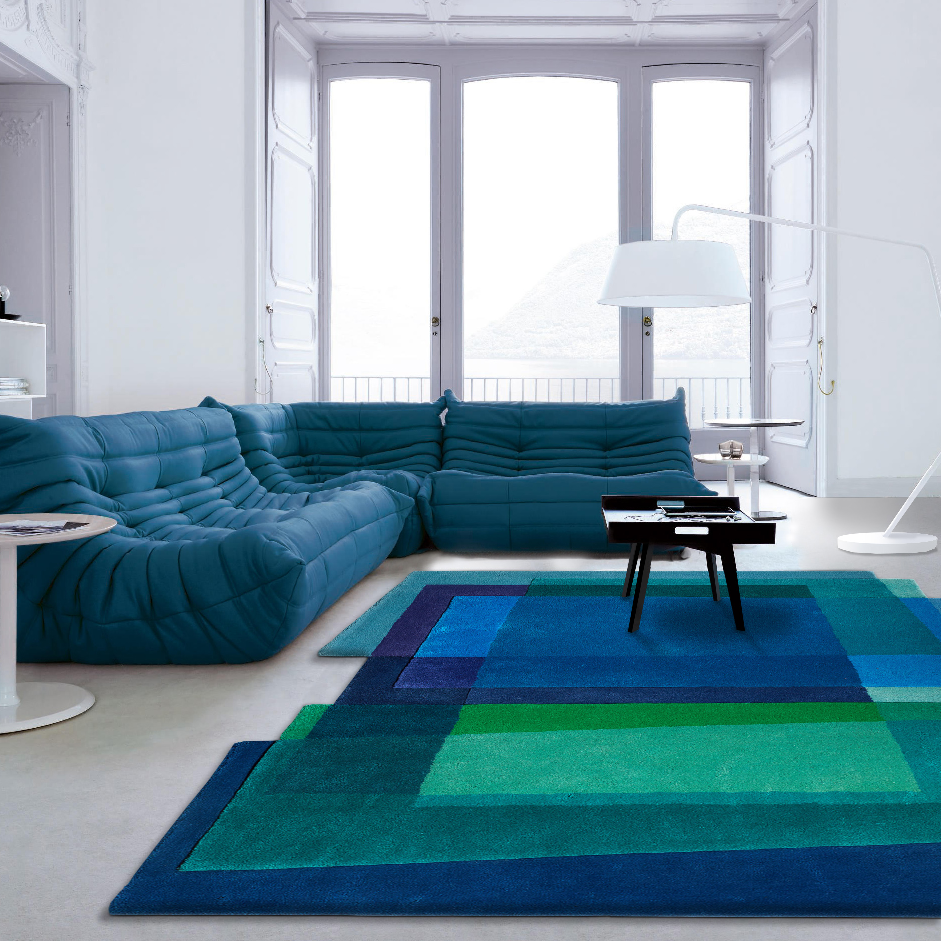 Blue togo sofa and blue contemporary rug