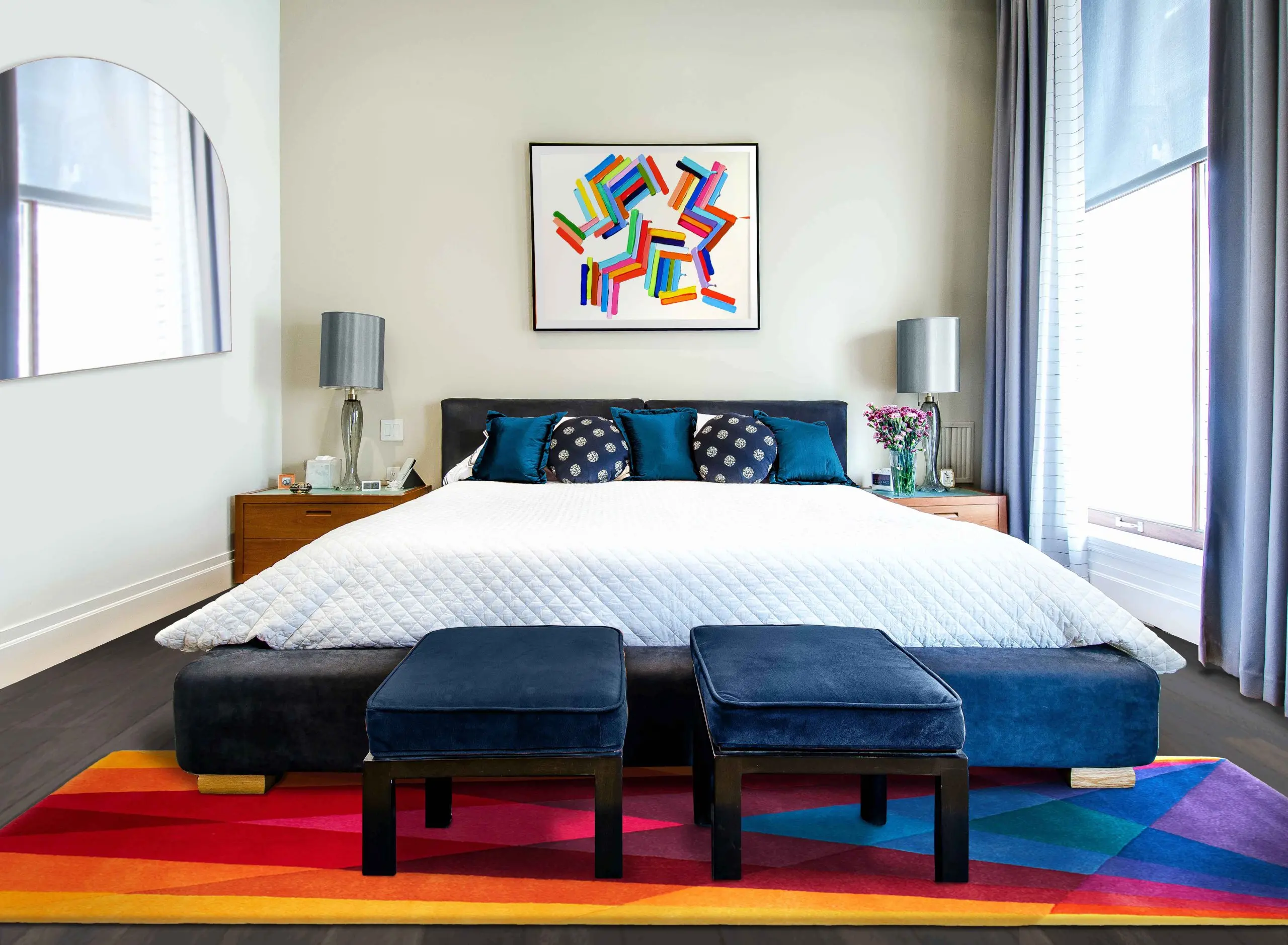 Our Rainbow Runner Rug at the foot of a bed