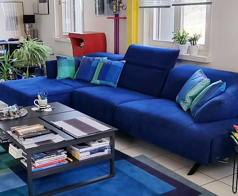 Set of 5 blue and green soft velvet cushions, pillows, After Albers Cornflower design on blue sofa