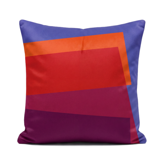 Purple, orange, red and pink soft velvet cushion on white background
