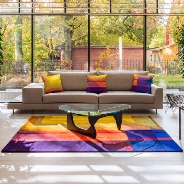 MExico sunlight yellow orange blue cushions on sofa in living room