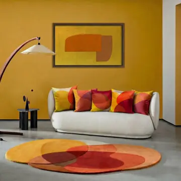 Yellow, orange, red and brown soft velvet set of 5 cushions on sofa