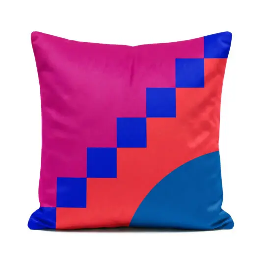 Geometric designer pink, red and blue Santorini Sunset cushion on white background