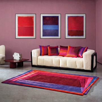 Luxury Rothko esque red deep velvet cushions on sofa