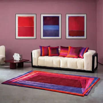 Luxury Rothko esque red deep velvet cushions on sofa