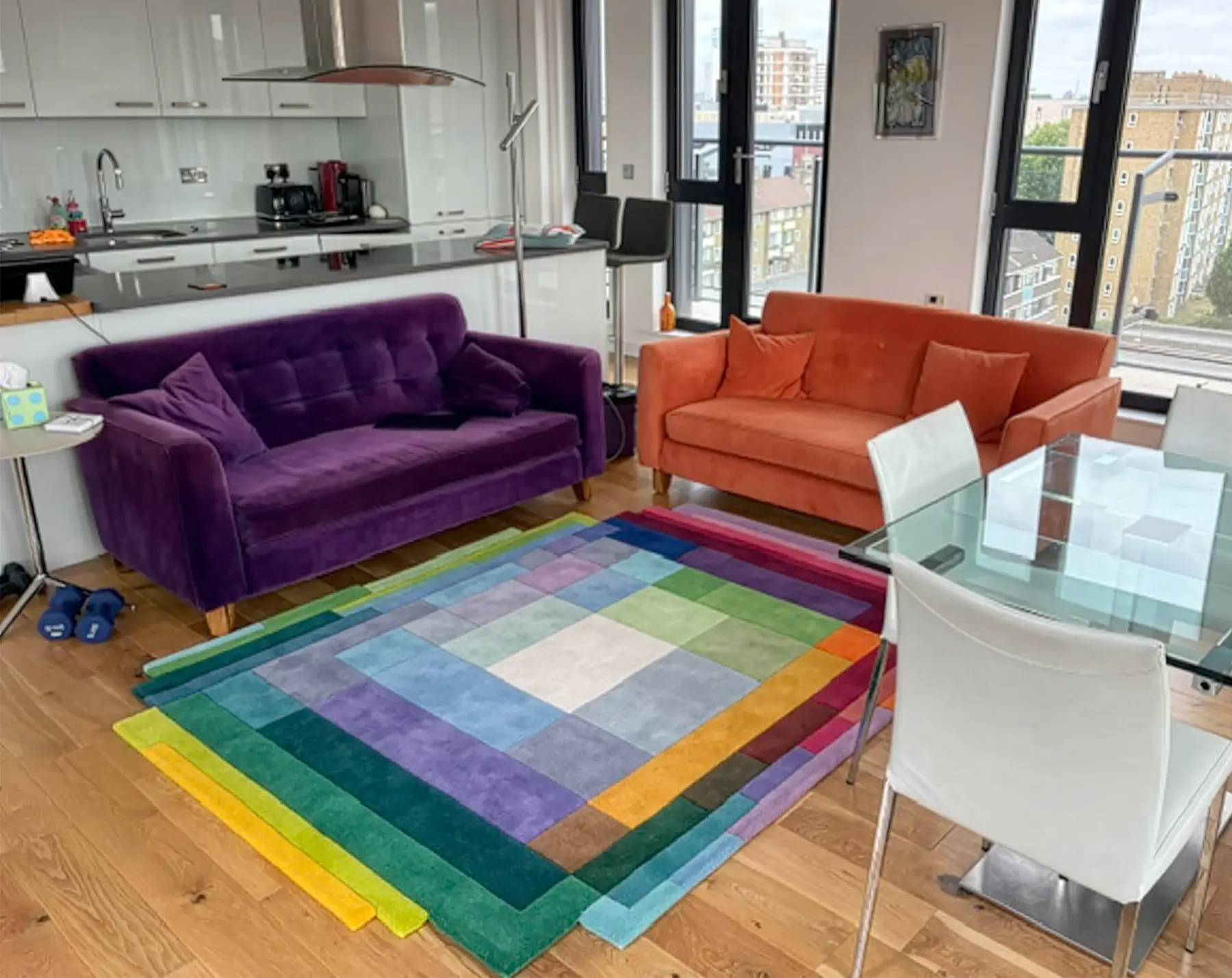 Designer colourful rug with geometric lines in living room